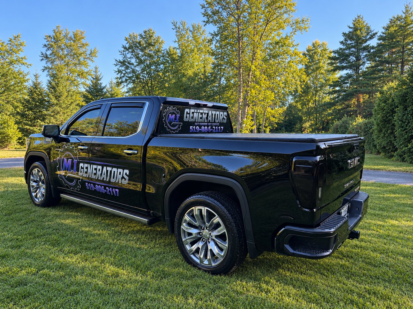 M.I Generators logo and rear-window graphic on the company truck